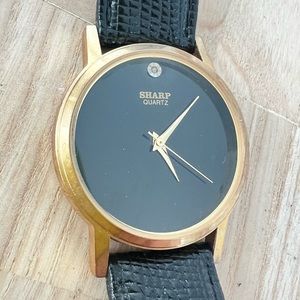 Sharp ladies black dial gold tone black leather dress watch NEW BATTERY